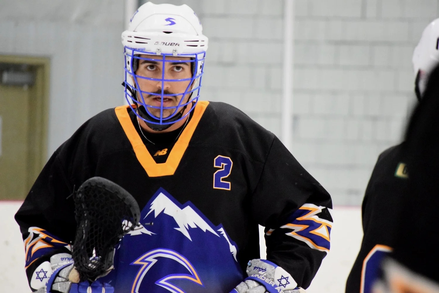 Salt Lake Storm box lacrosse player on the floor